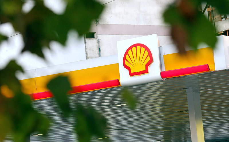 Shell reins in its share buyback programme after profit halves