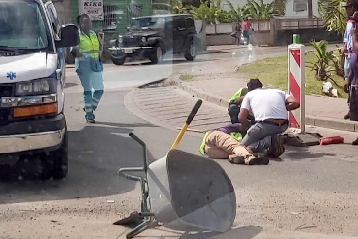       Man cleaning road  hit from the back   