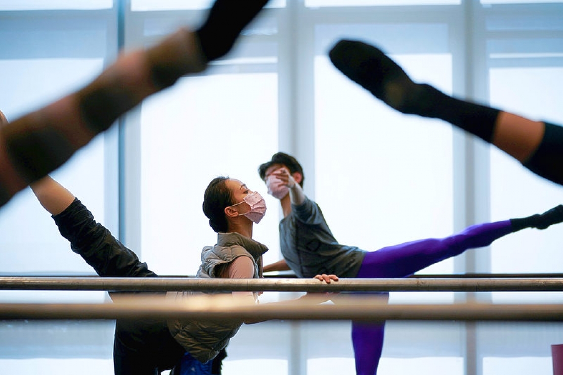 Masked against coronavirus, ballet dancers pirouette and plie in China