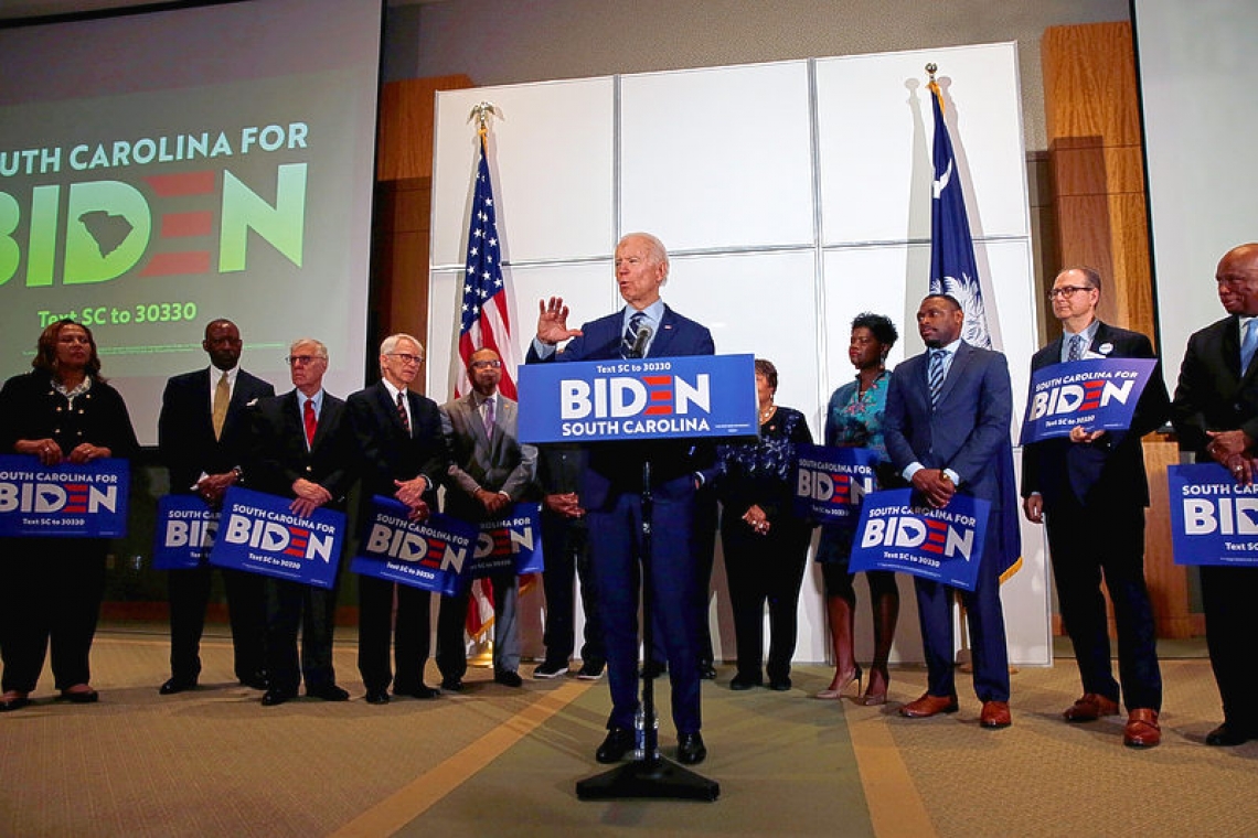 Ad spending nears $900 mln, Biden lands key endorsement