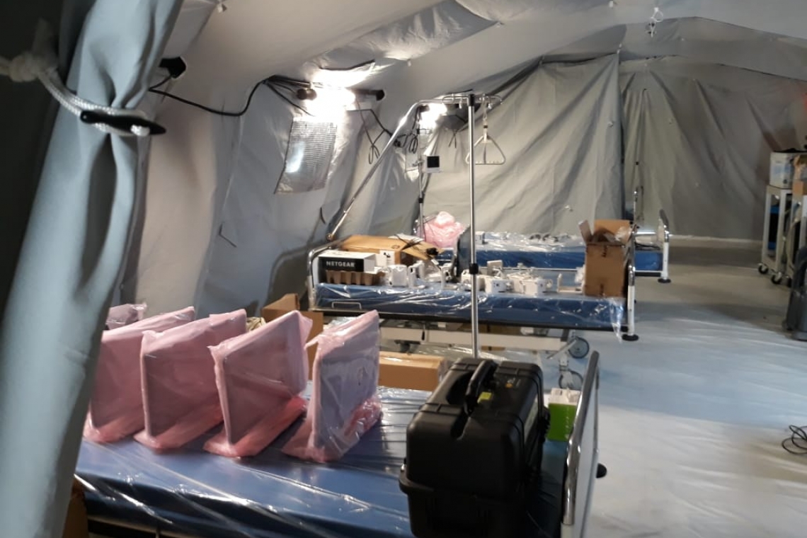       Fire Department, Marines  finish assembling ICU tent     