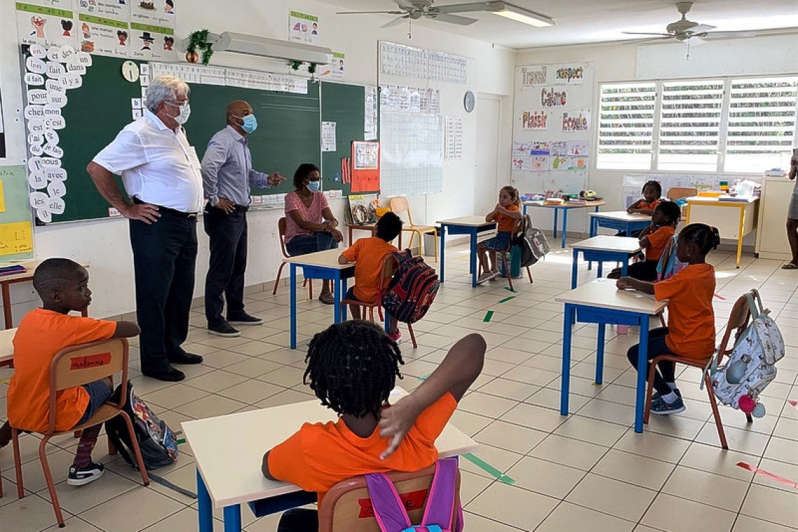 President Gibbs visits primary school classes on first day back