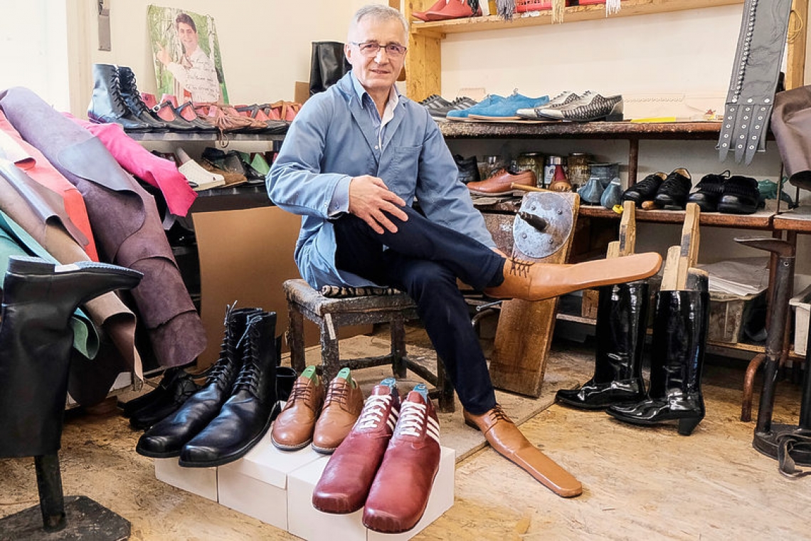 Romanian cobbler keeps people apart with size 75 