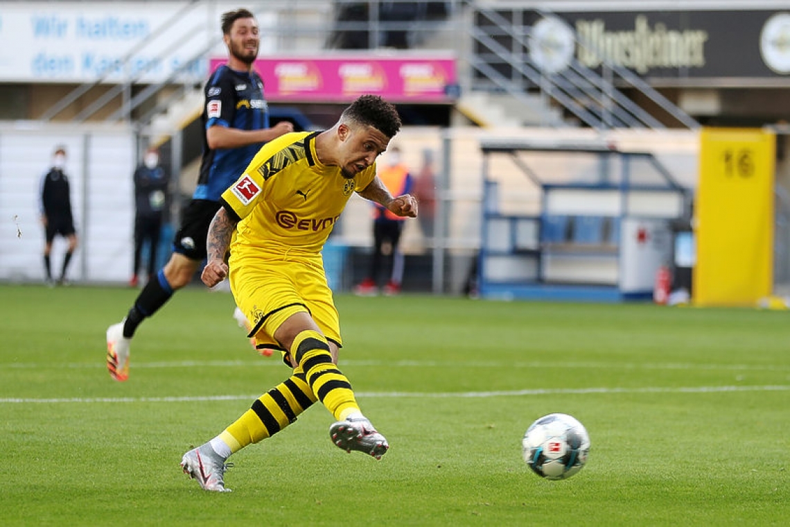 Sancho hat-trick keeps  Dortmund in title hunt