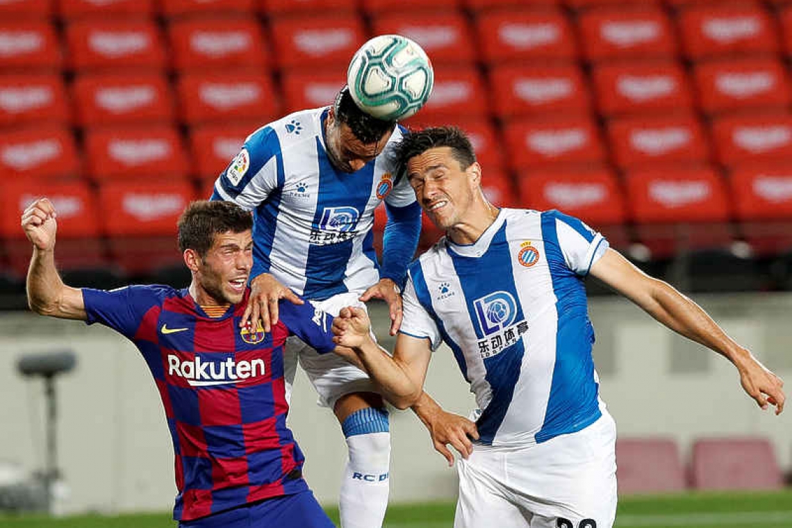 Suarez nets winner as Barcelona condemn Espanyol to relegation