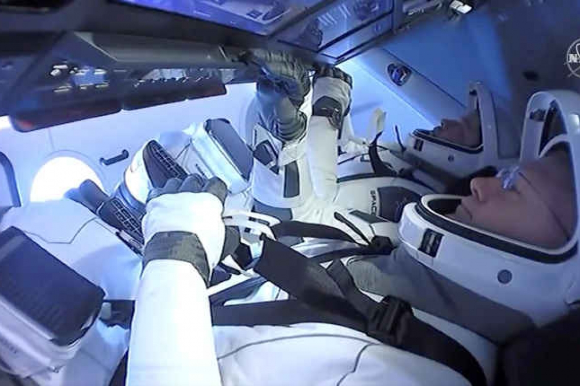 NASA astronauts make historic return home aboard SpaceX capsule