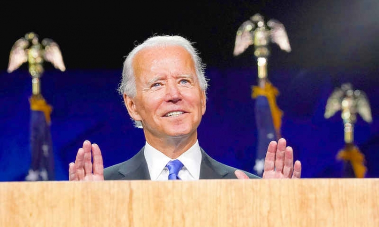 Vowing to turn page on Trump era, Biden promises 'light' over 'darkness'