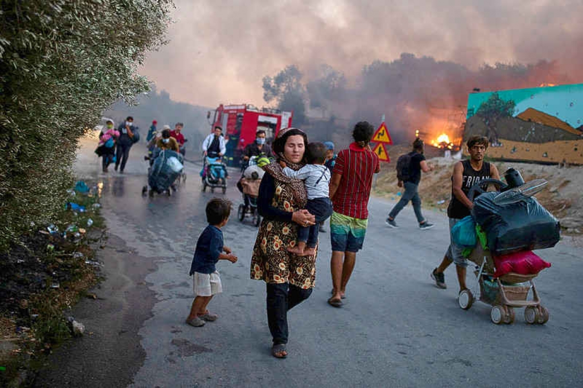 Thousands homeless after fire guts migrant camp on Greek island