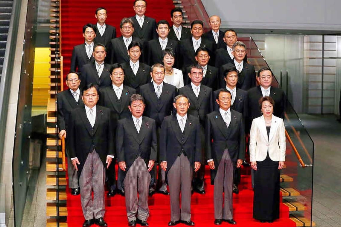 New Japanese prime minister crafts 'continuity cabinet', pledges reform