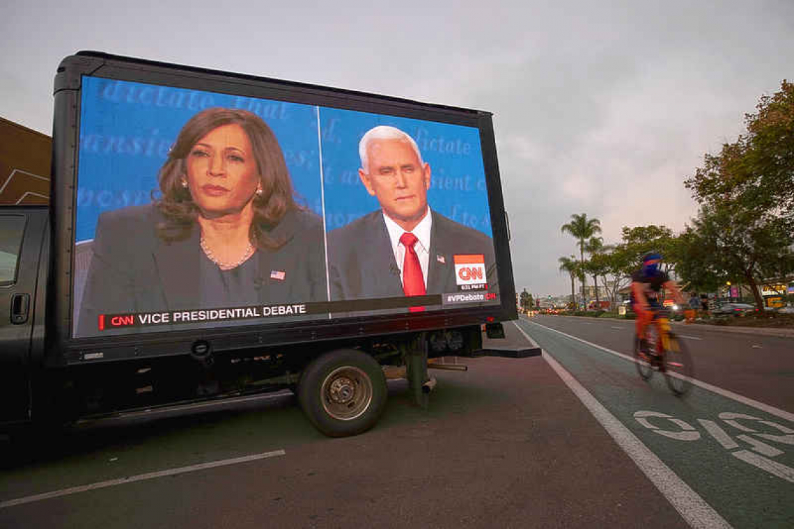 Harris, Pence clash over Trump's virus response