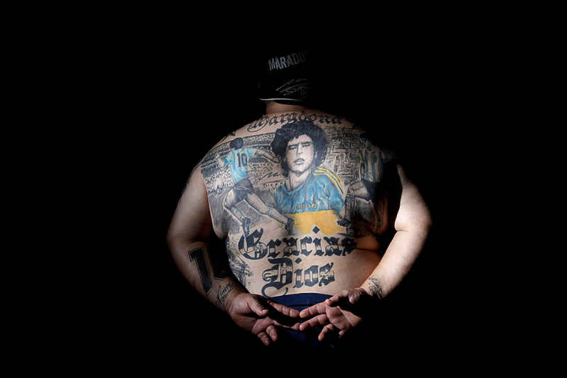 Argentines celebrate 'eternal love' for Maradona with tattoos