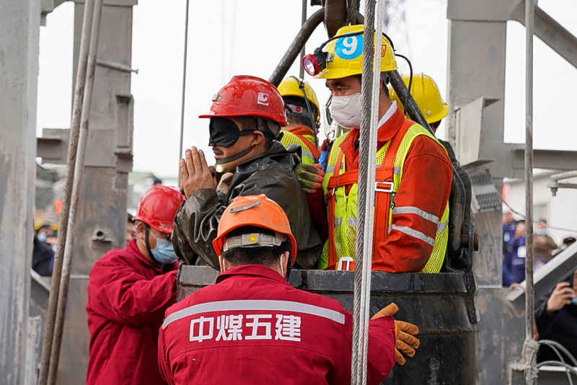 Eleven trapped miners rescued in China after 14 days underground
