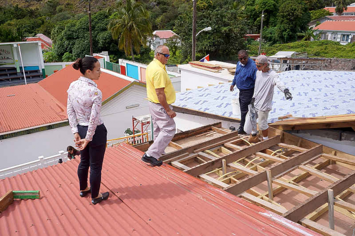 New roof for Youth Center,  light poles up at sports field