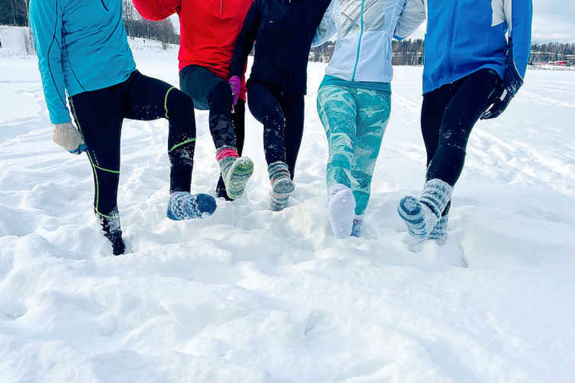 Weary of COVID restrictions, Finns take up running in deep snow in socks