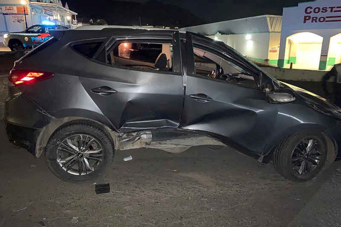 SUV rolls over after  hitting a bus stop