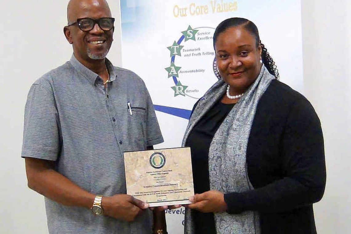KCN receives  plaque from ECCB