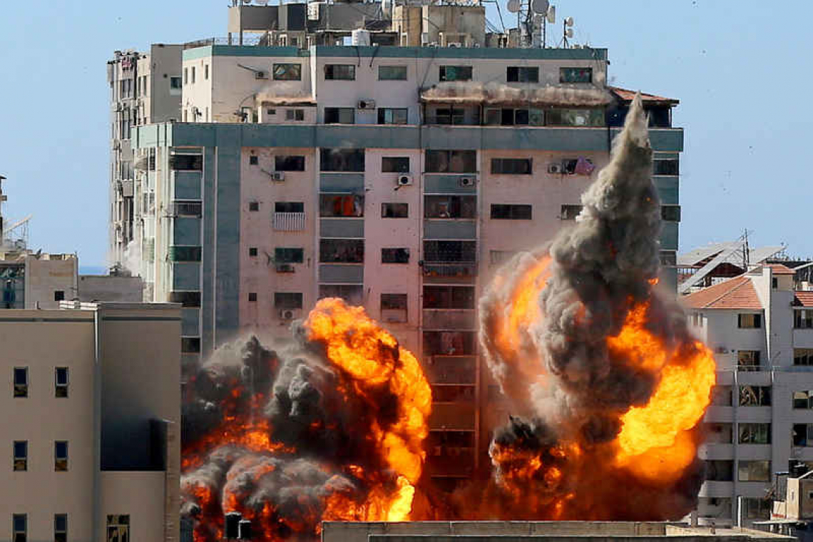 Israel launches dozens of strikes, Gaza fighting enters second week