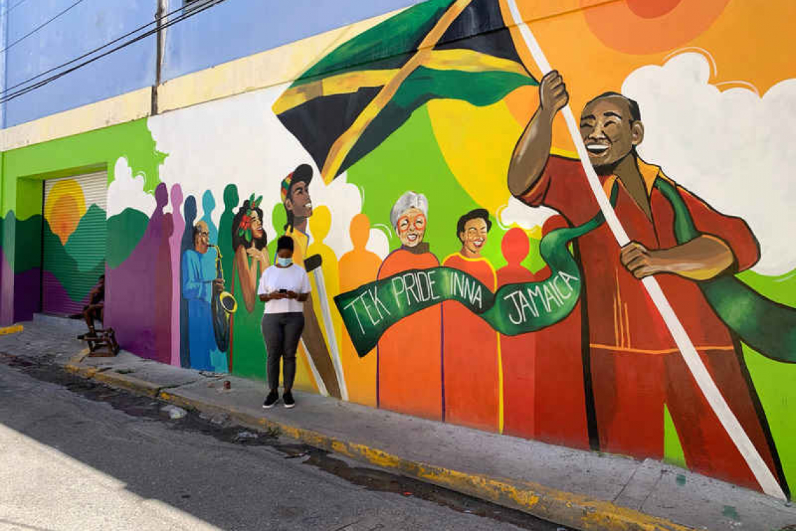 Jamaican artists paint murals to revive derelict downtown