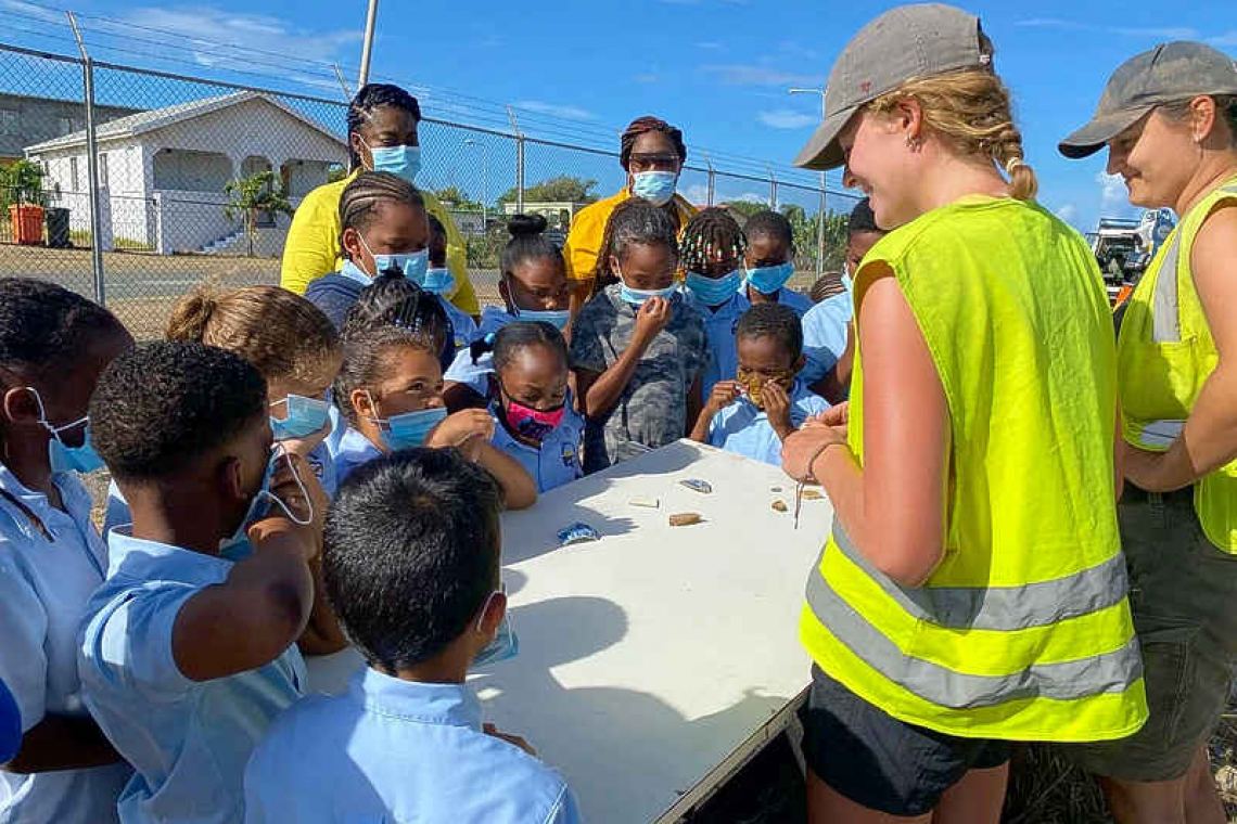 Schoolchildren get dirty at  archaeological site in Statia