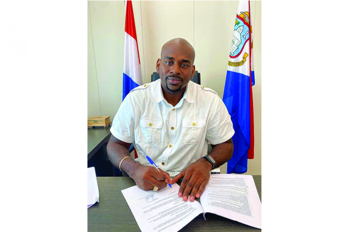 Ottley signs bilateral agreement  for food assistance programme