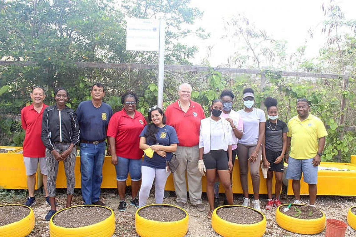 Rotary and Lions Clubs create  tyre garden at hurricane shelter