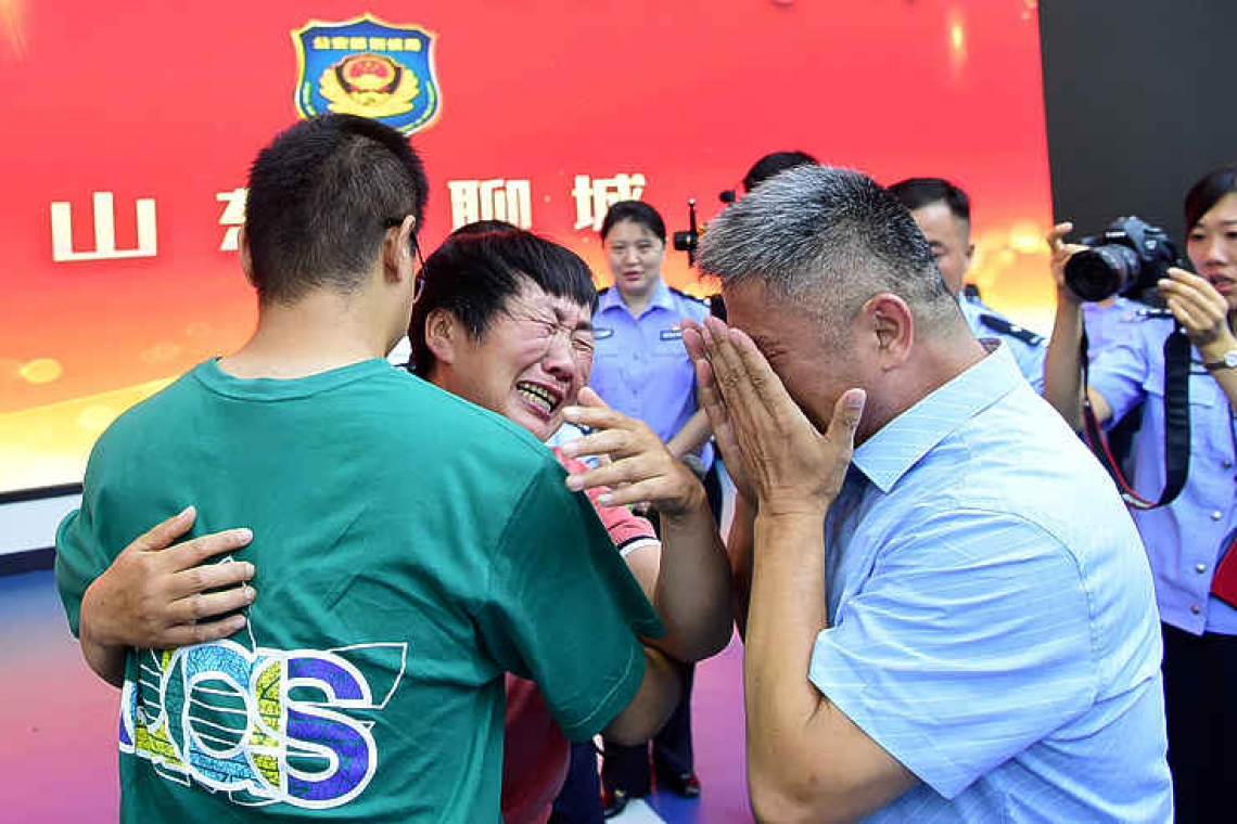 After a 24-year search, Chinese man reunited with kidnapped son