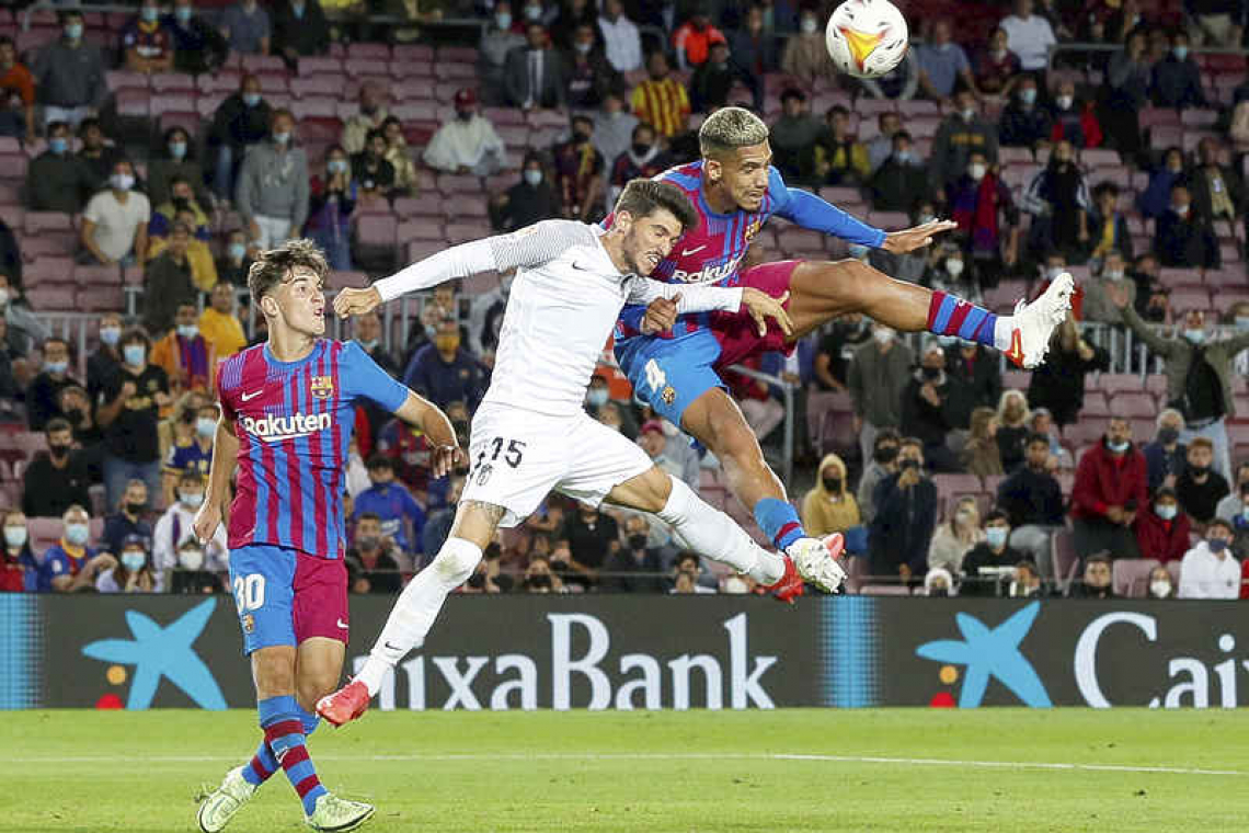 Barcelona scrape late 1-1 draw with Granada as fans stay away
