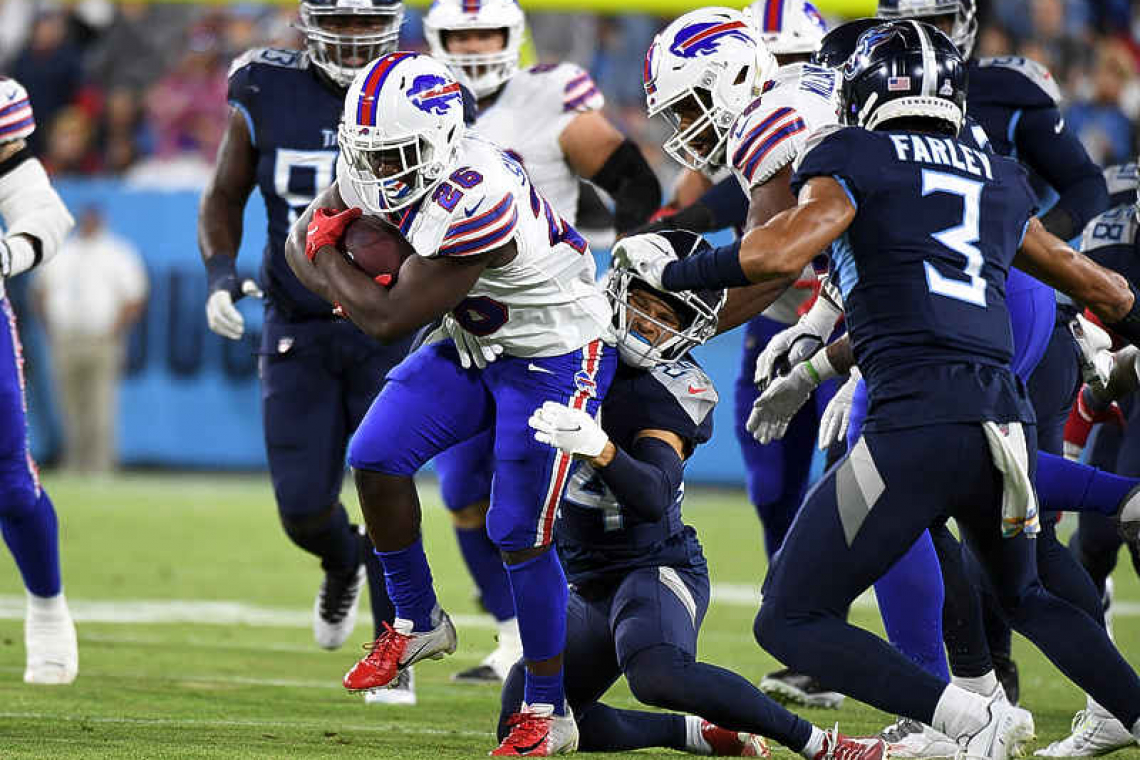 Titans stuff Bills near goal  line, survive for wild win