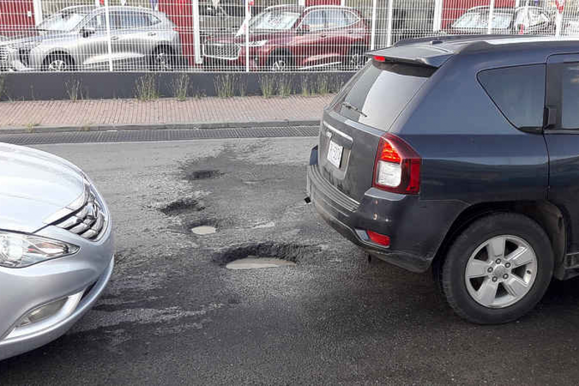 Potholes galore  in familiar spot