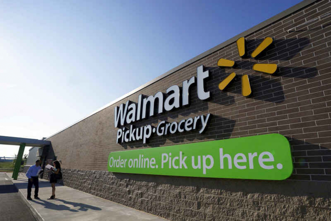 Walmart posts record holiday sales as spending remains firm