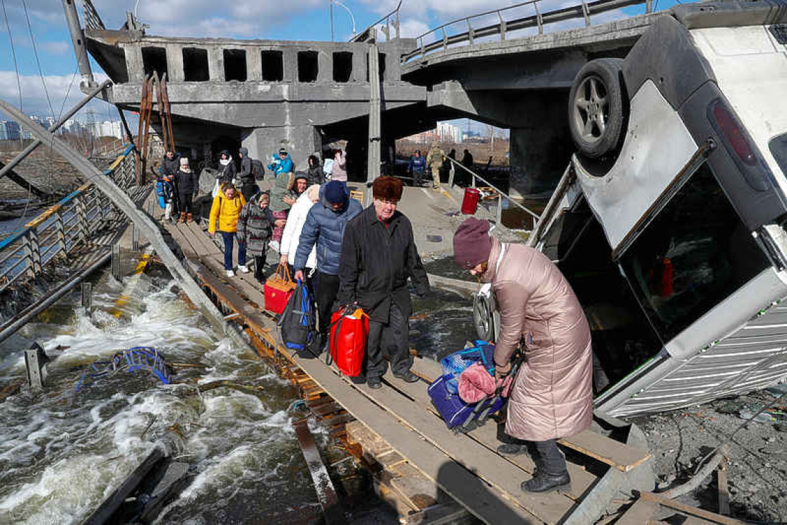 Besieged Ukrainians endure bombardments, with no breakthrough in talks