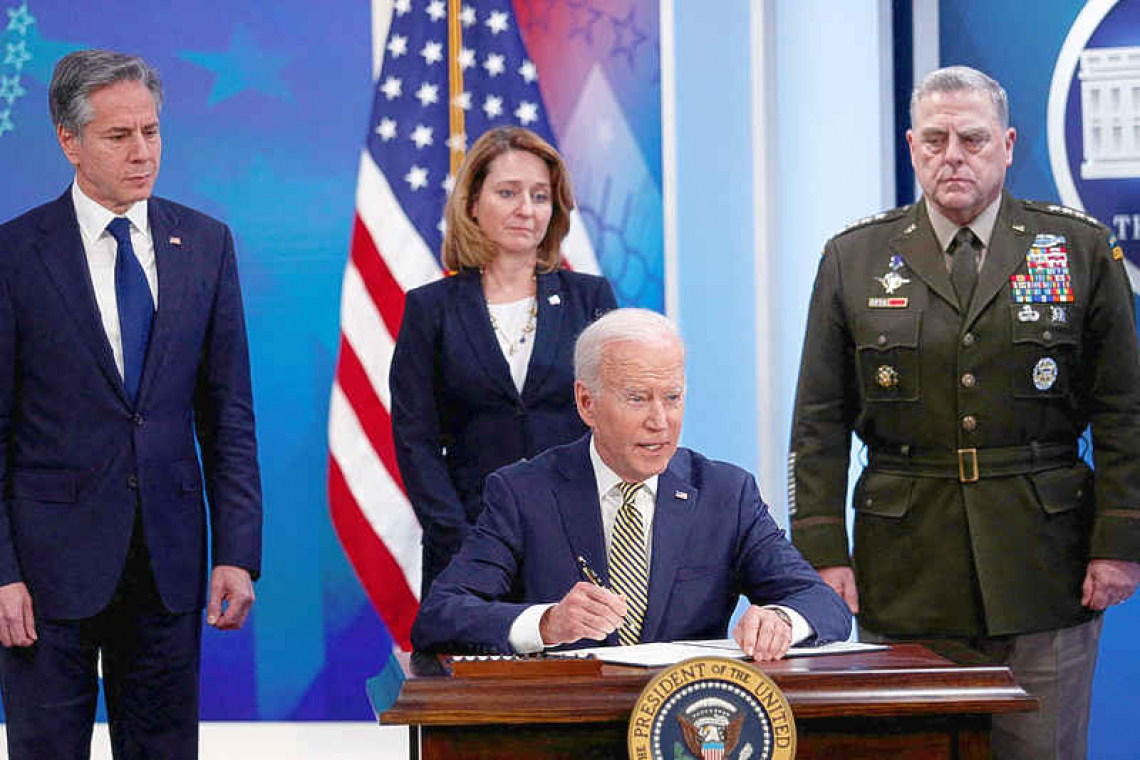 Biden calls Putin a war criminal, Russia says mission 'going to plan'