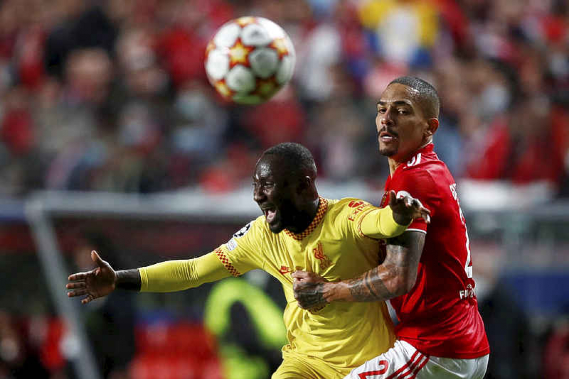    Liverpool down Benfica to take firm grip on tie