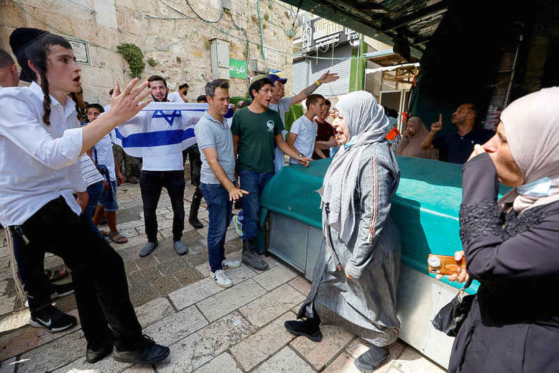 Flag-waving Israelis take to streets, skirmishes erupt in Al-Aqsa mosque