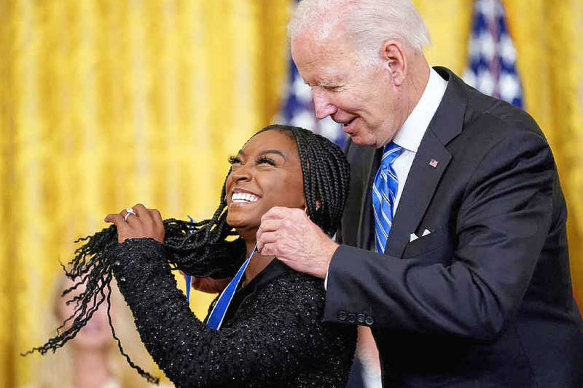  Biden awards medal of freedom to Biles, Rapinoe, late Senator McCain
