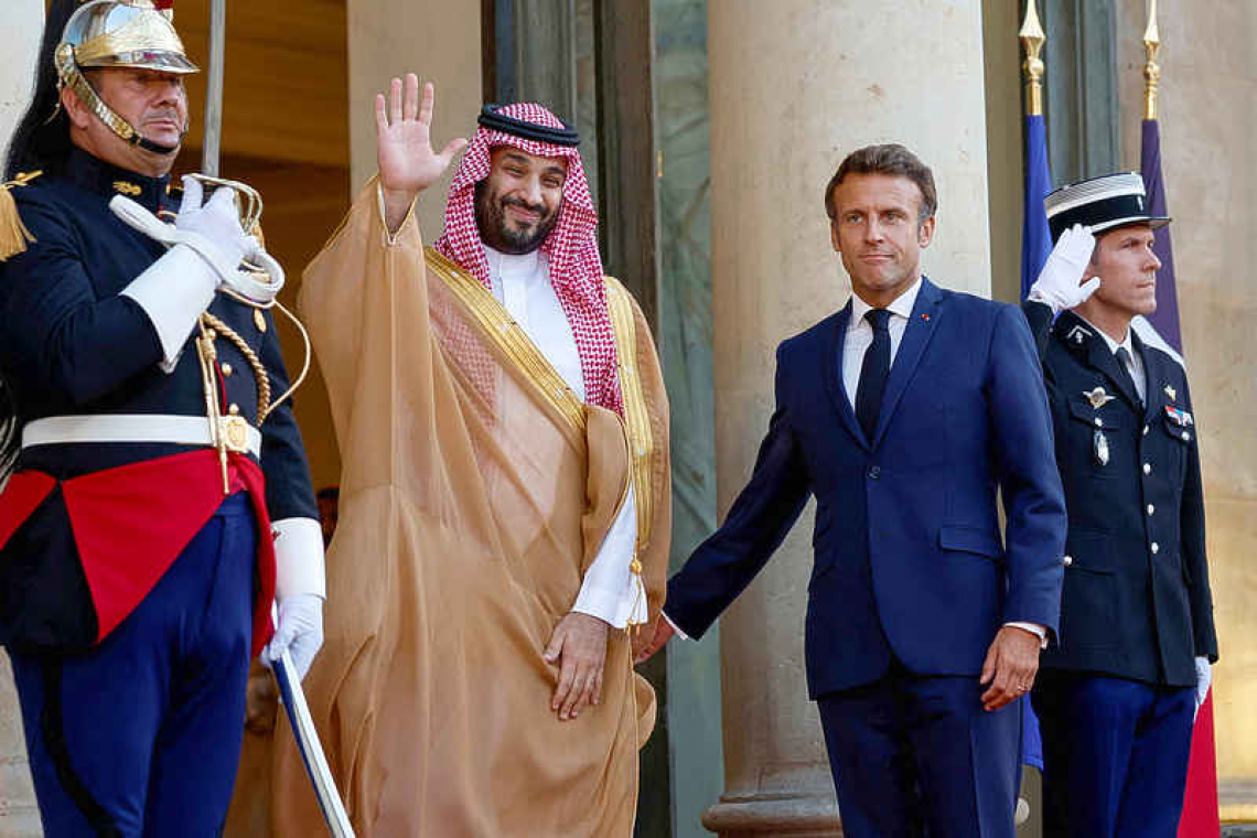 Macron hosts Saudi crown prince with oil, Iran and rights on agenda