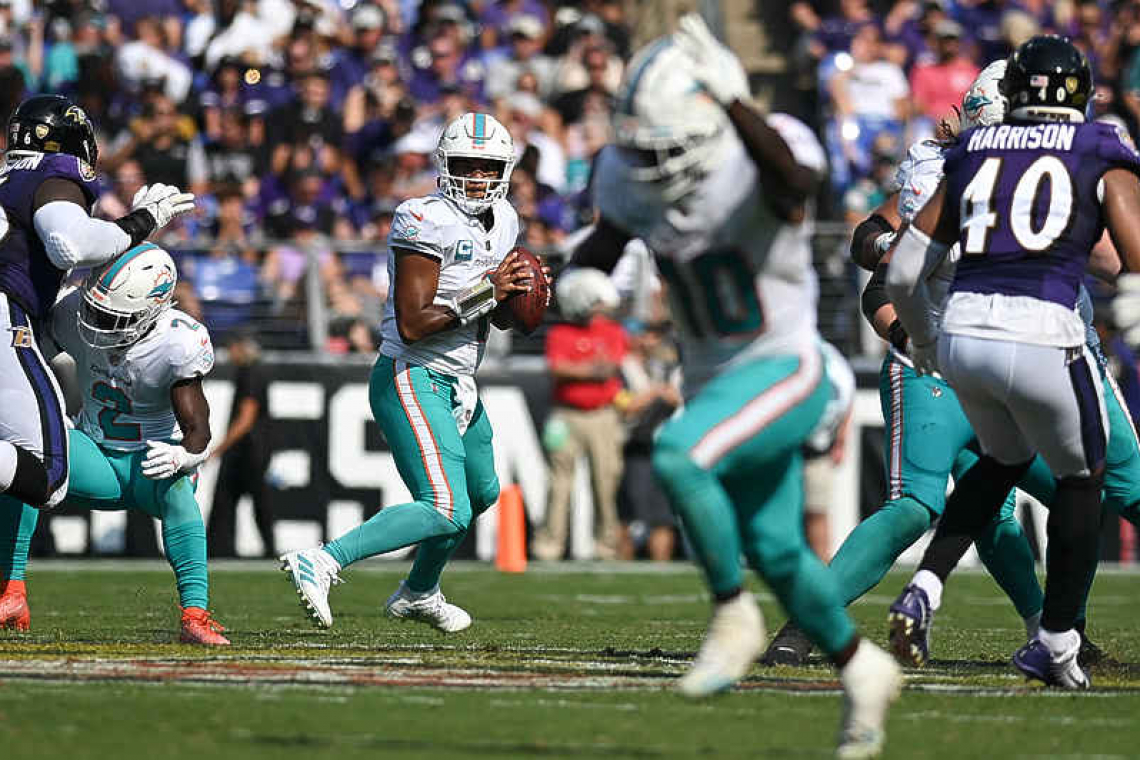 Dolphins rally behind Tua's 6 TD passes to shock Ravens