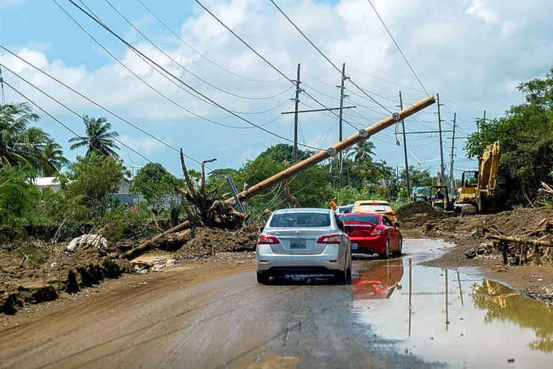    Puerto Rican municipal workers pitch in as power outages persist