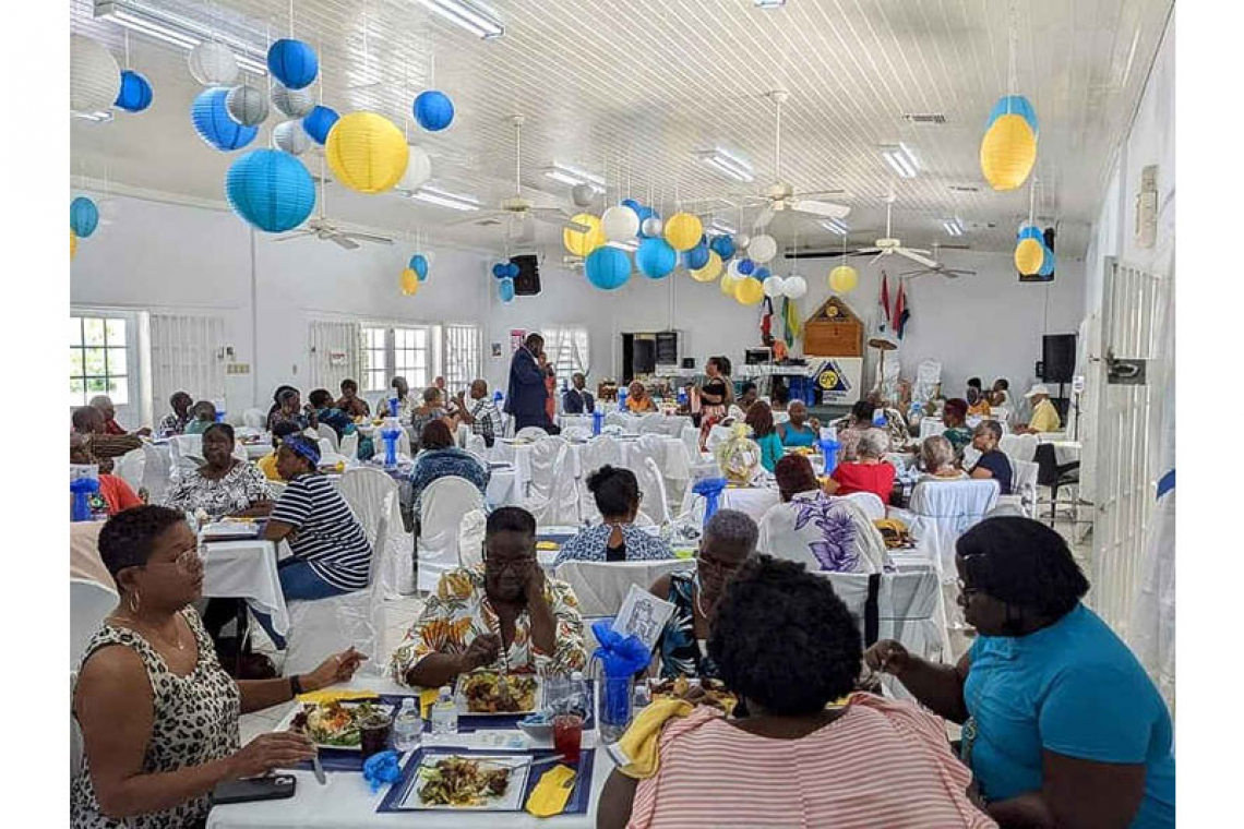 Seniors from both sides mingle and  feast for Intl. Day of Older Persons