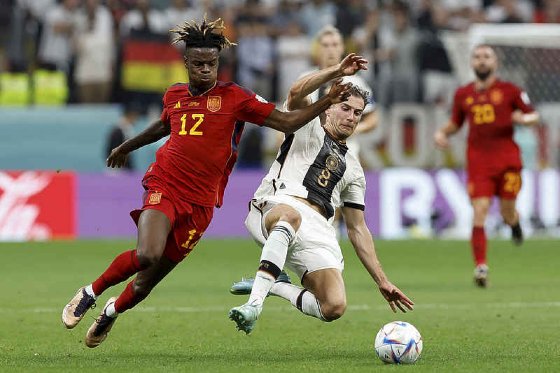 Germany breath life into World Cup campaign in battling draw with Spain