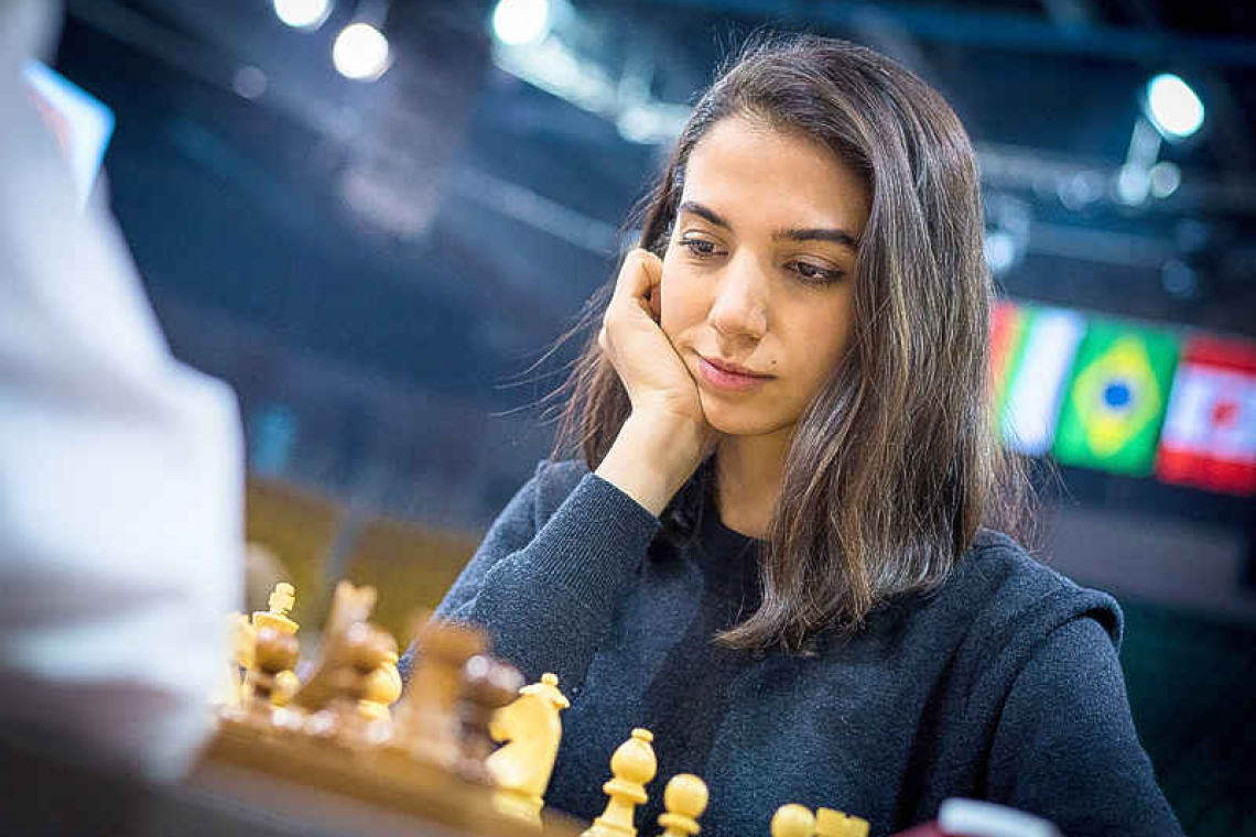 Iranian woman competes at chess tournament without wearing hijab
