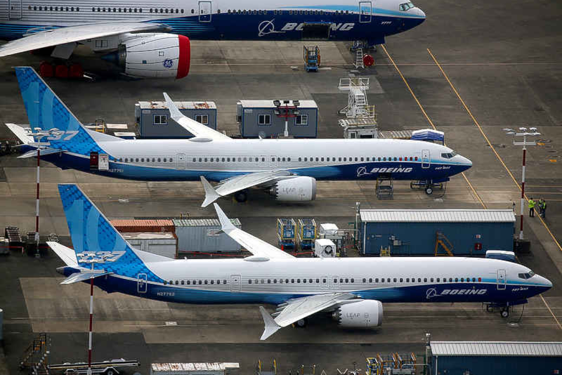 Boeing reports loss, but first positive free cash