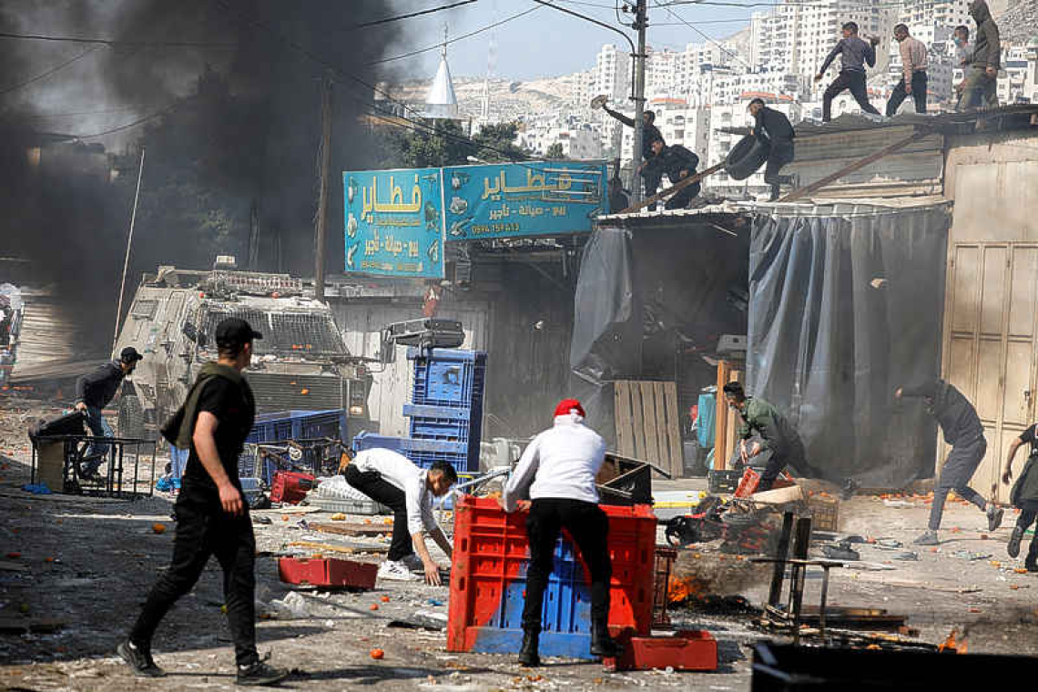 Israeli troops kill 11 Palestinians in West Bank clash, medics say