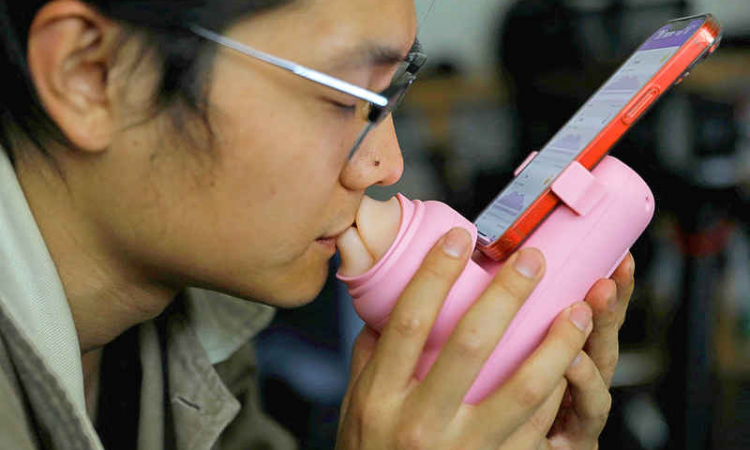Firm invents lockdown-inspired kissing machine for remote lovers