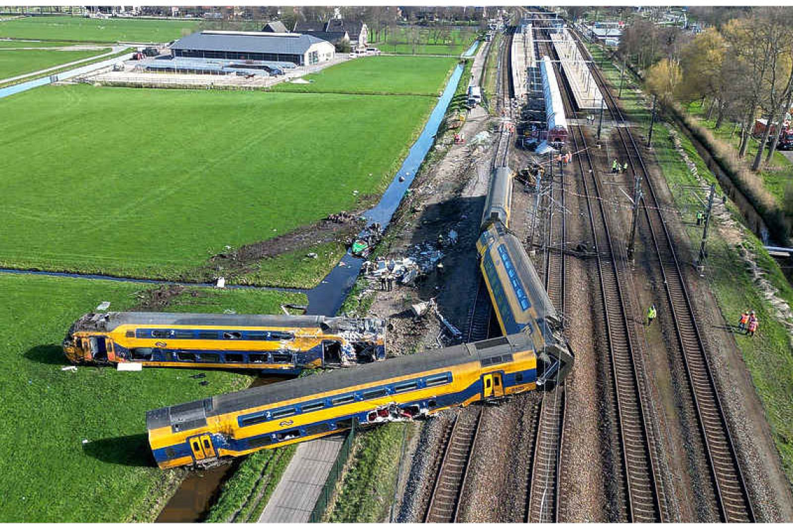 Train crashes into maintenance  crane, killing one, dozens hurt