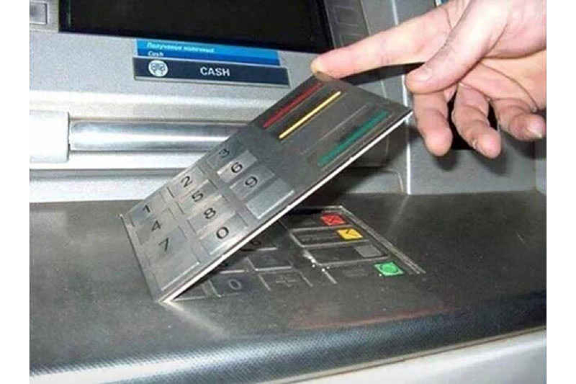 Police detain suspect carrying  credit card skimming devices