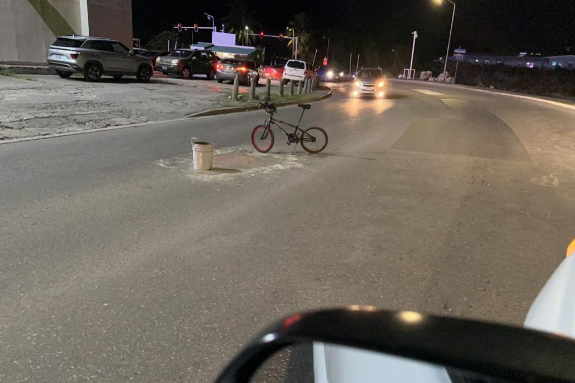 Resident  fills potholes 