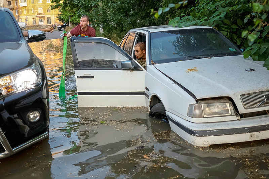 Tens of thousands at risk from flooding in wake of dam collapse 