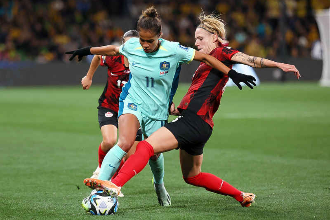 Raso fires Australia into World Cup knockouts as Canada blitzed 4-0 