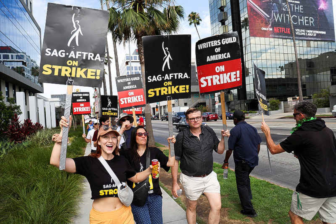 100-day strike: Hollywood writers show unity and anger on picket lines